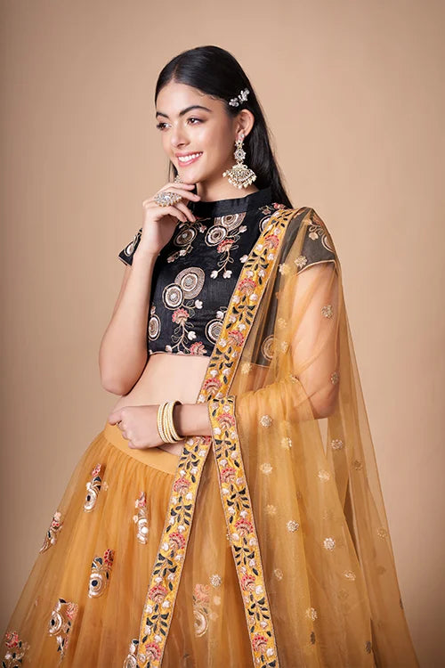 Gold Color Exquisite Soft Net Embellished Lehenga Choli For Festive Fervor