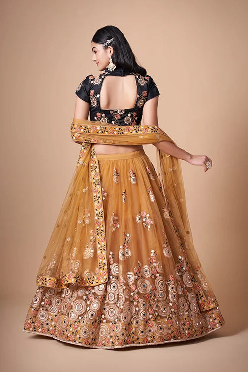Gold Color Exquisite Soft Net Embellished Lehenga Choli For Festive Fervor
